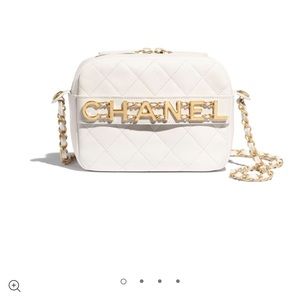 White luxurious camera chanel purse.